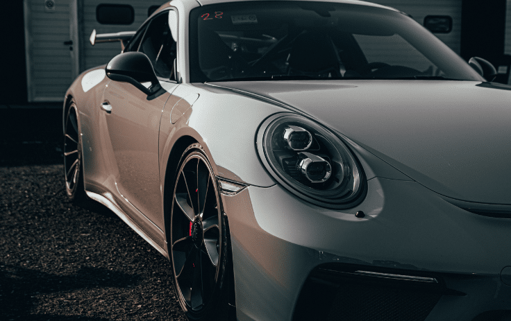A sports car with ceramic coating is parked outside